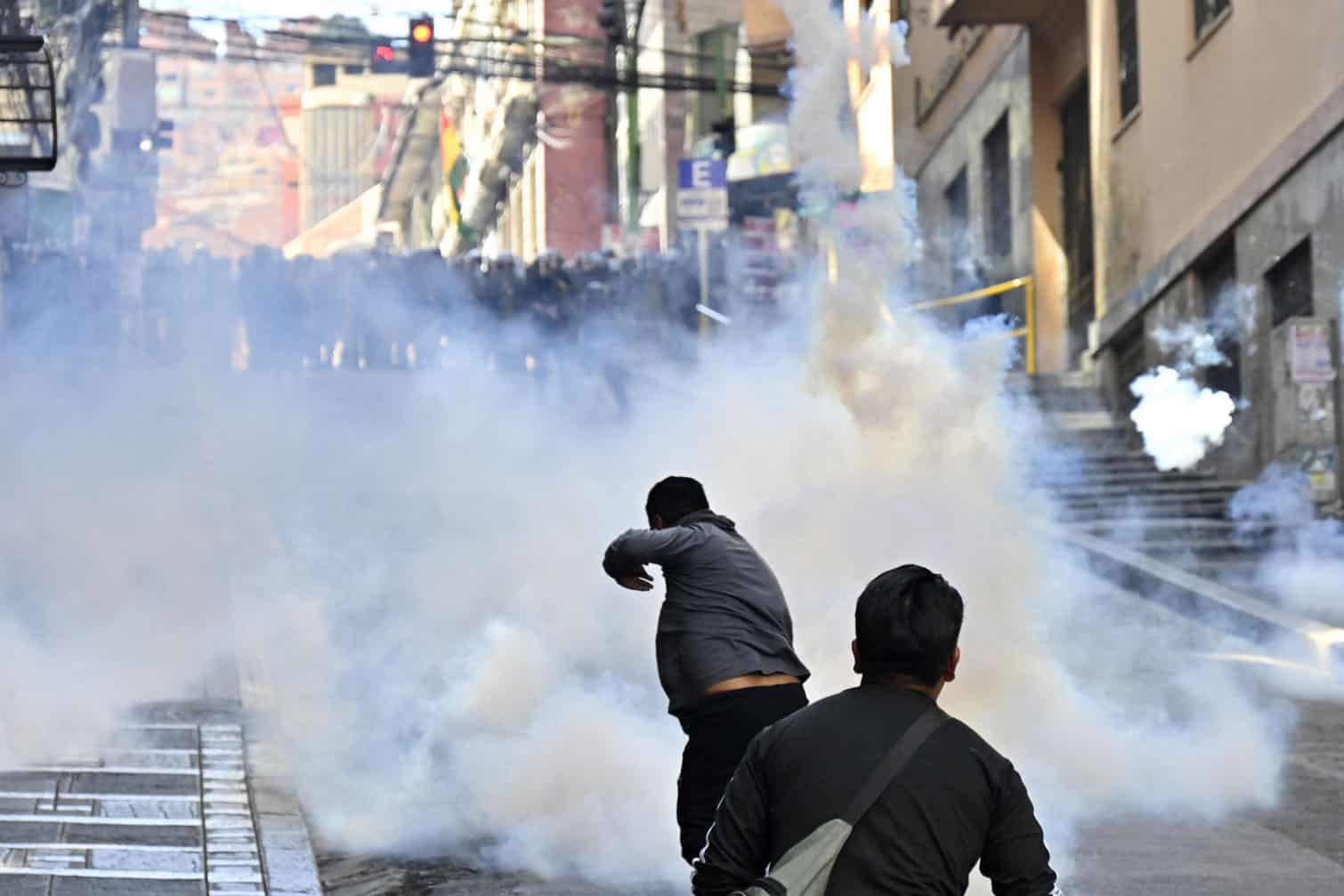 Riot police fire tear gas to demonstrators