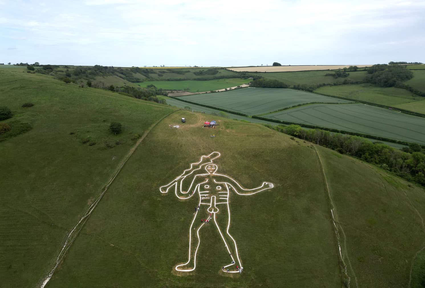 An aerial photograph shows the Cerne Abbas Giant