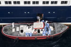 This aerial view shows health personnel assisting patients
