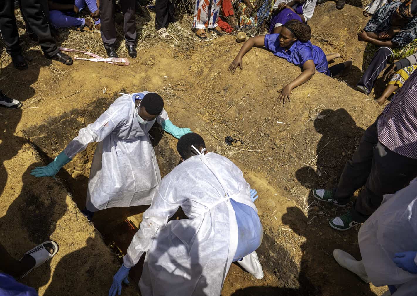a person suspected of having died from Ebola is buried
