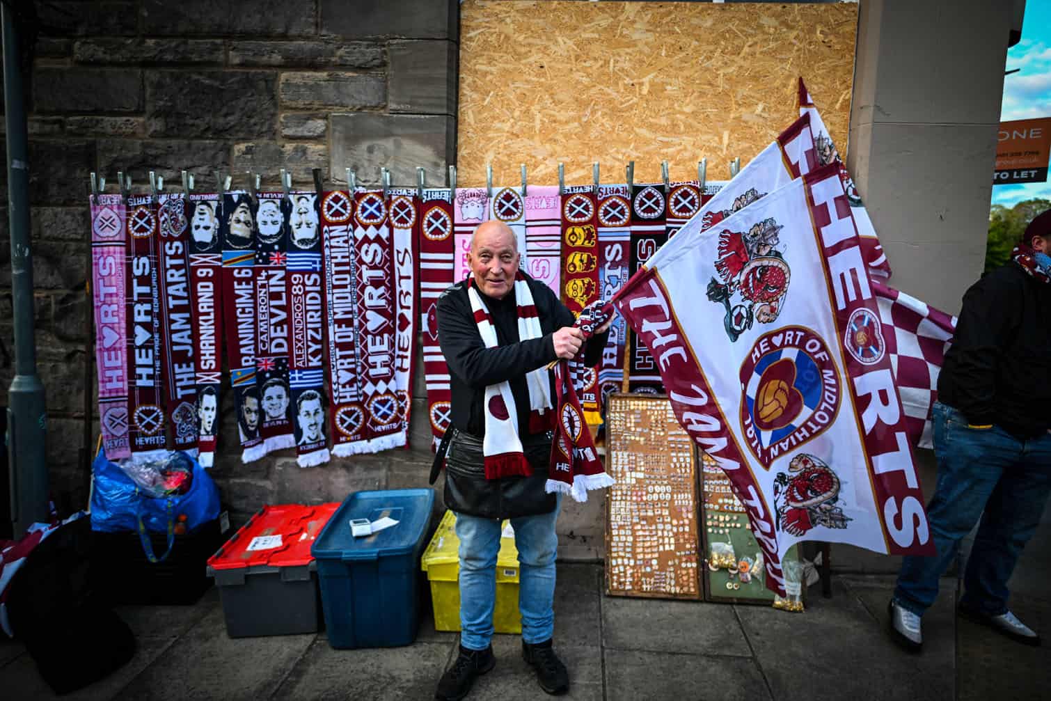 A vendor sells merchandise outside the stadium