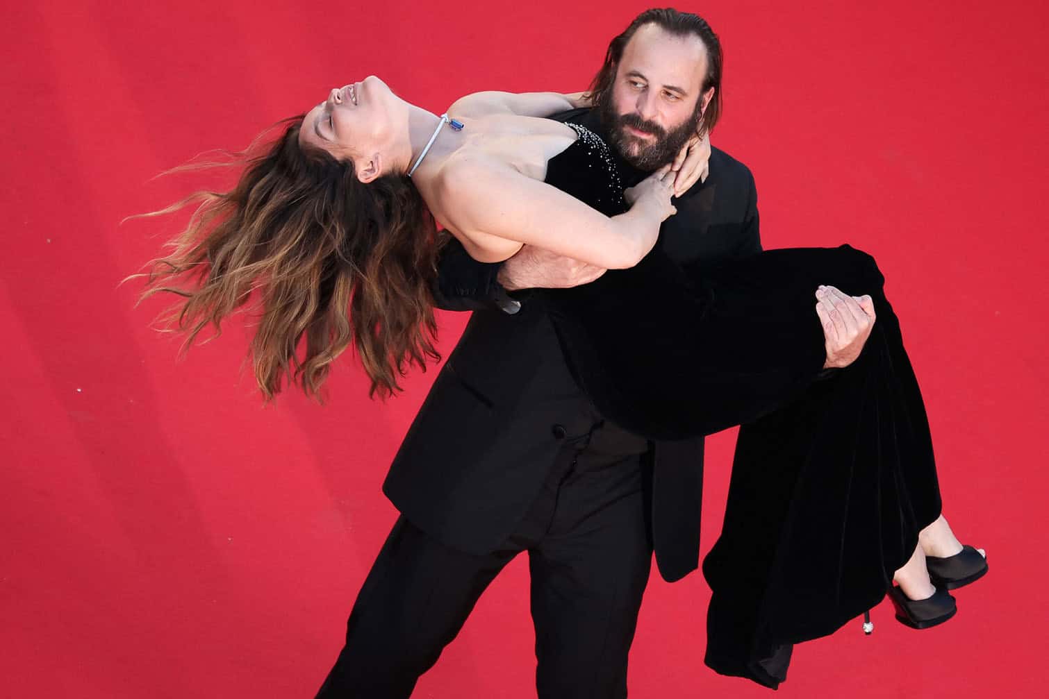 French actor Vincent Macaigne carries French actress and model Laetitia Casta