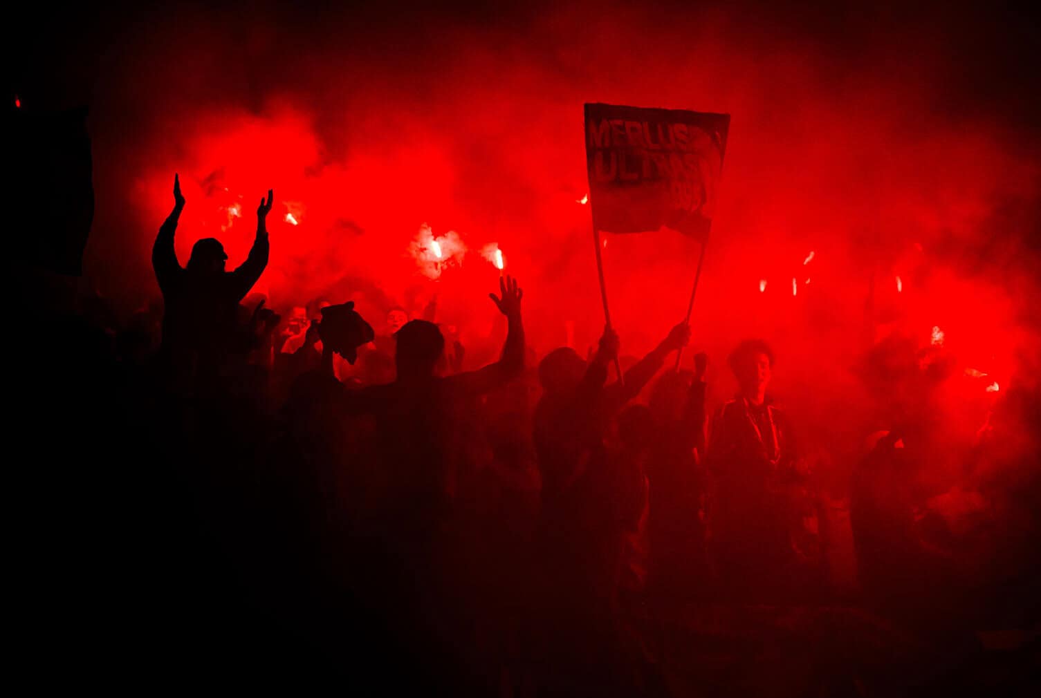 Lorient's supporters hold flares