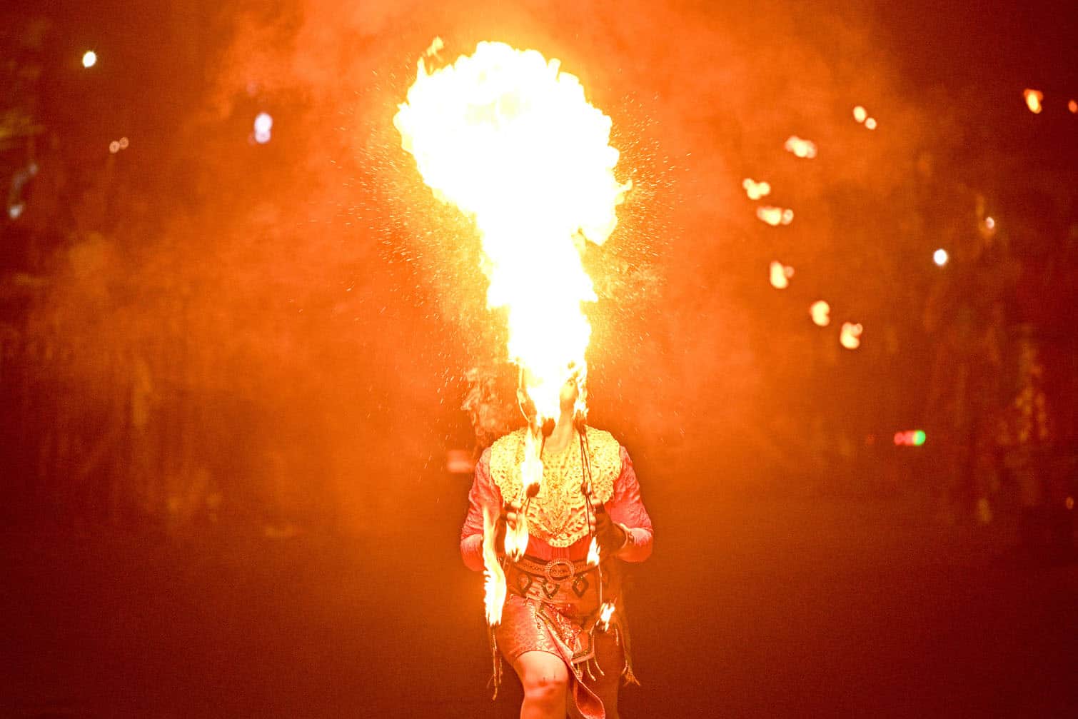 A fire breather performs during the Surabaya Vaganza