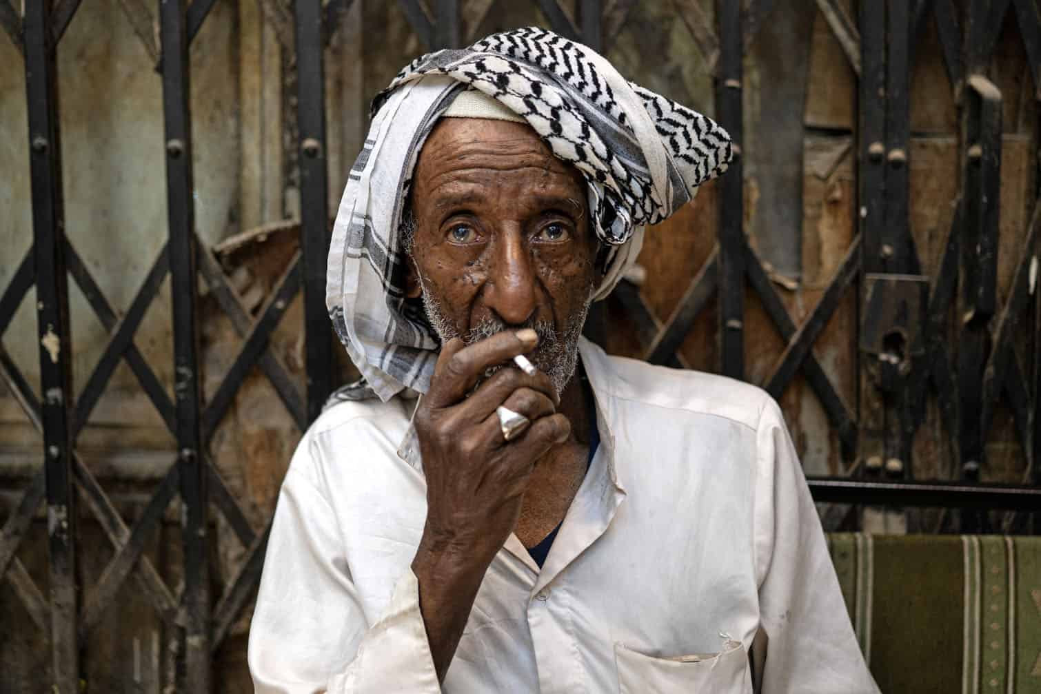 A man smokes a cigarette