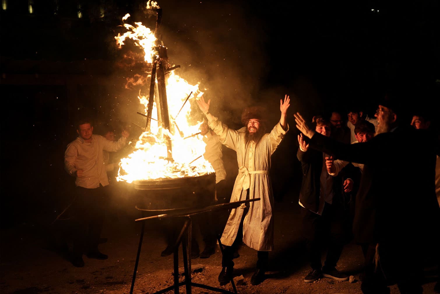 Ultra-Orthodox Jewish men dance around