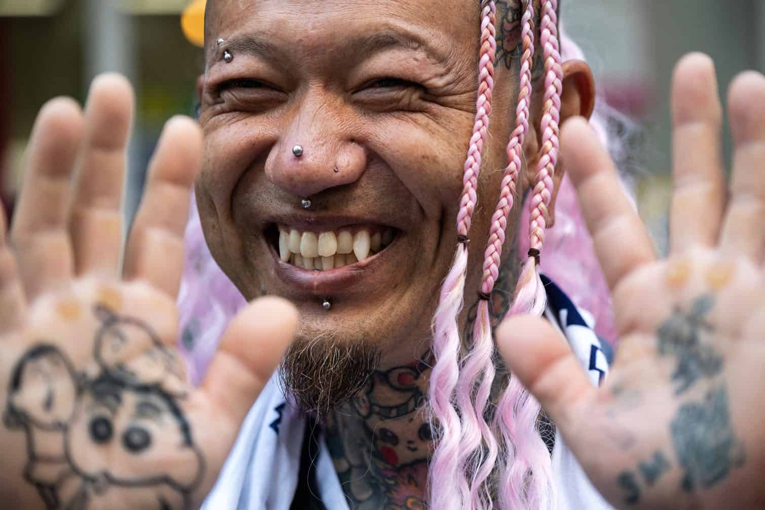 Akinori Atarashi shows his tattoos