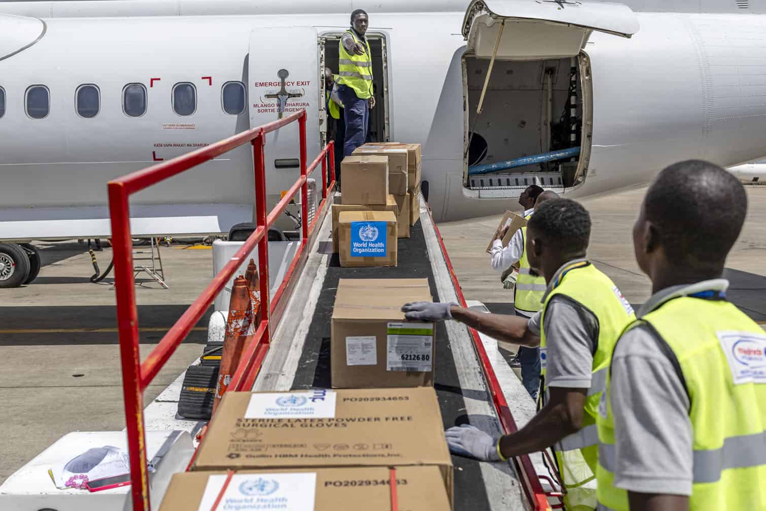 Ground crew load medical supplies