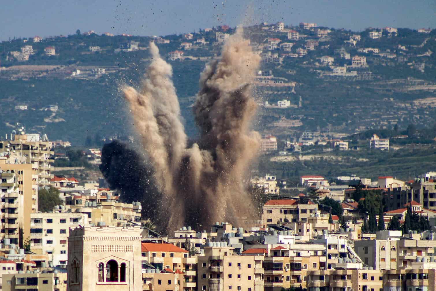 An explosion erupts in the area of al-Housh following Israeli bombardment
