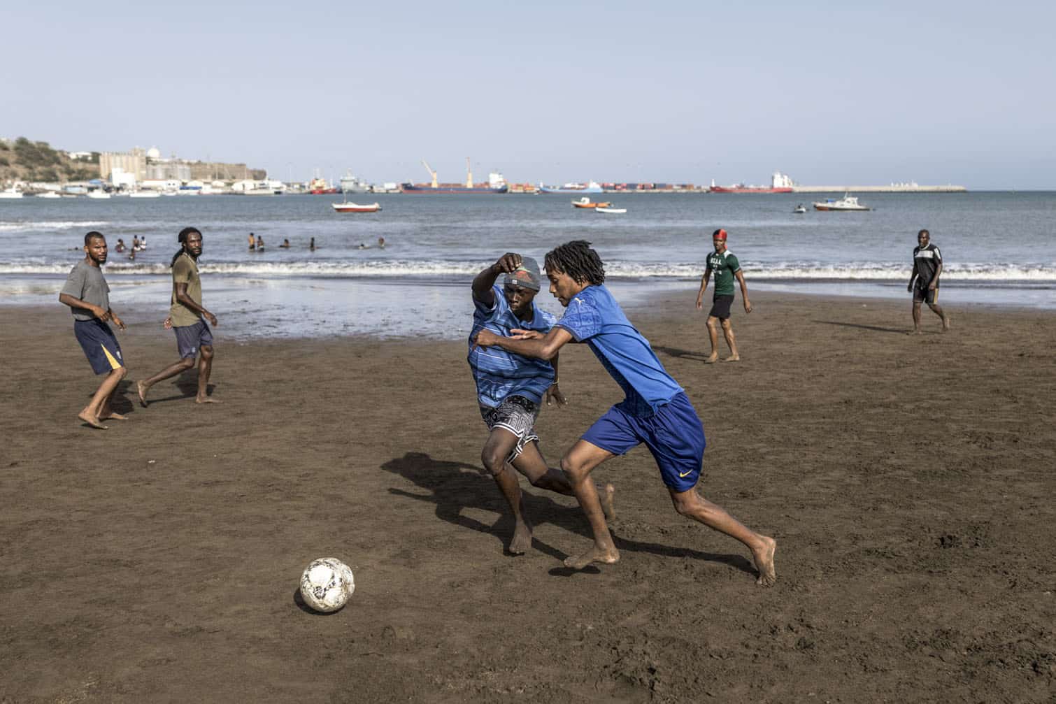 People play football at Gamboa Beach
