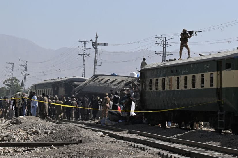 A Pakistani soldier aims his weapon