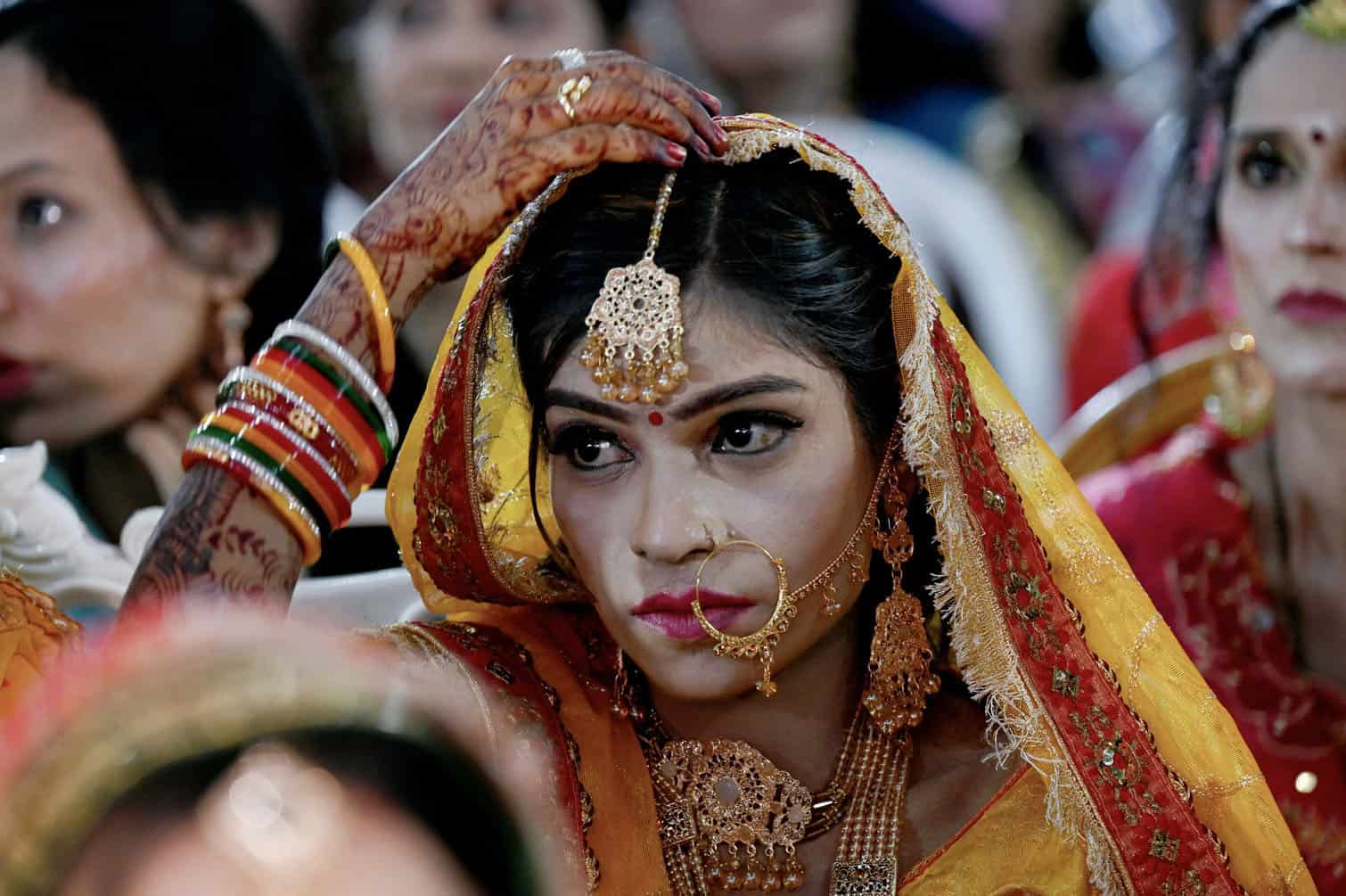 A Pakistani Hindu bride looks on