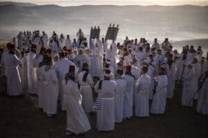 Samaritan priests raise Torah scrolls