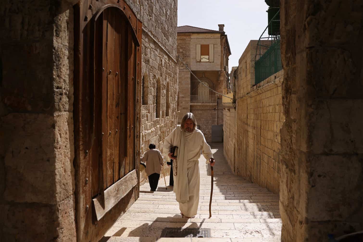 A pilgrim walks outside the Church of the Holy Sepulchre