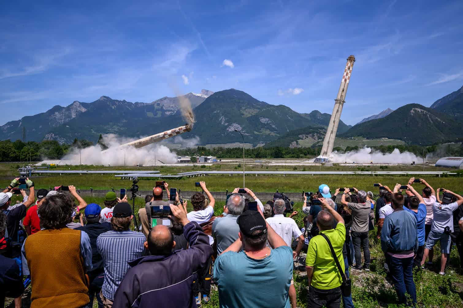 Attendees watch the controlled demolition by explosion