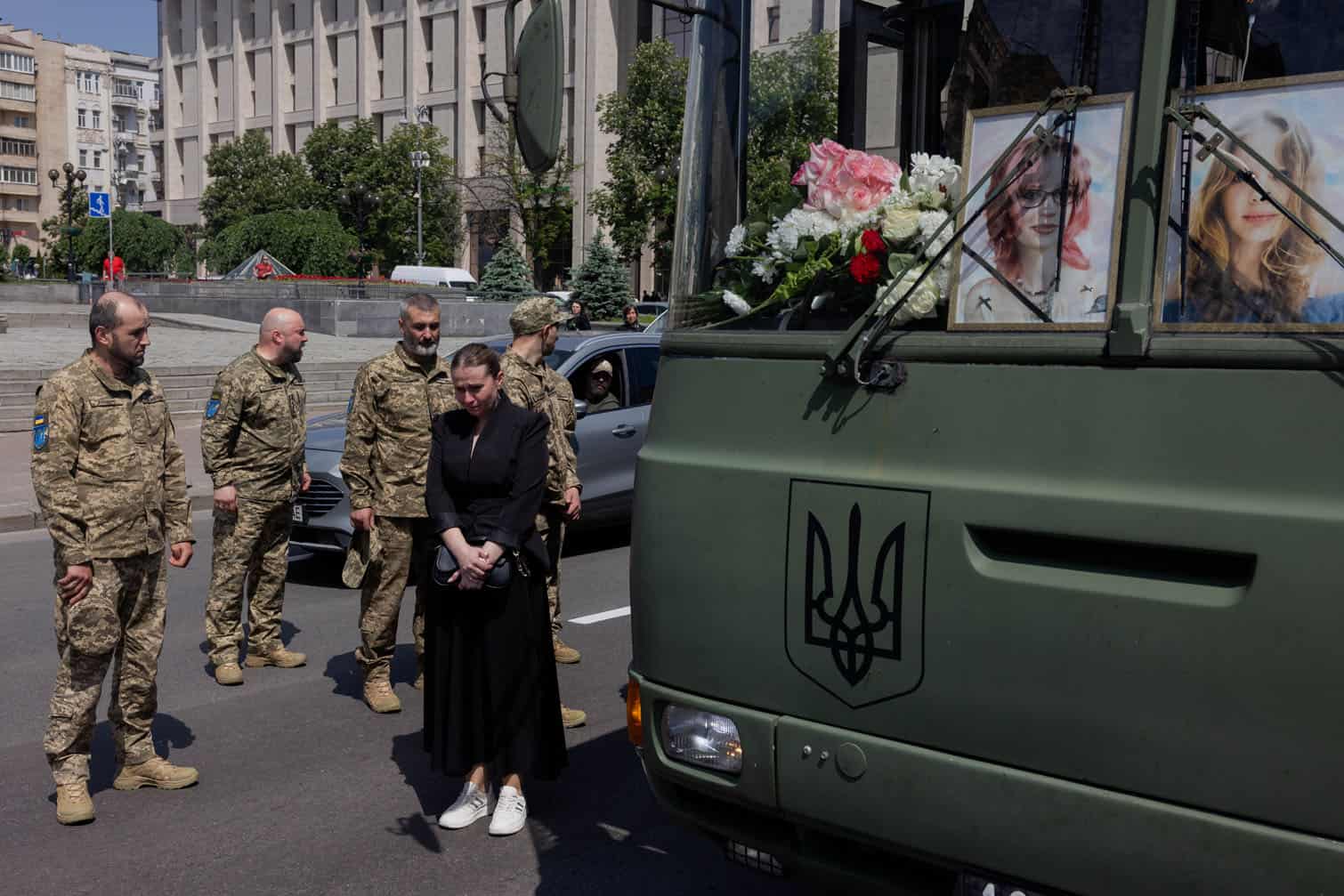 A woman and ukrainian service men