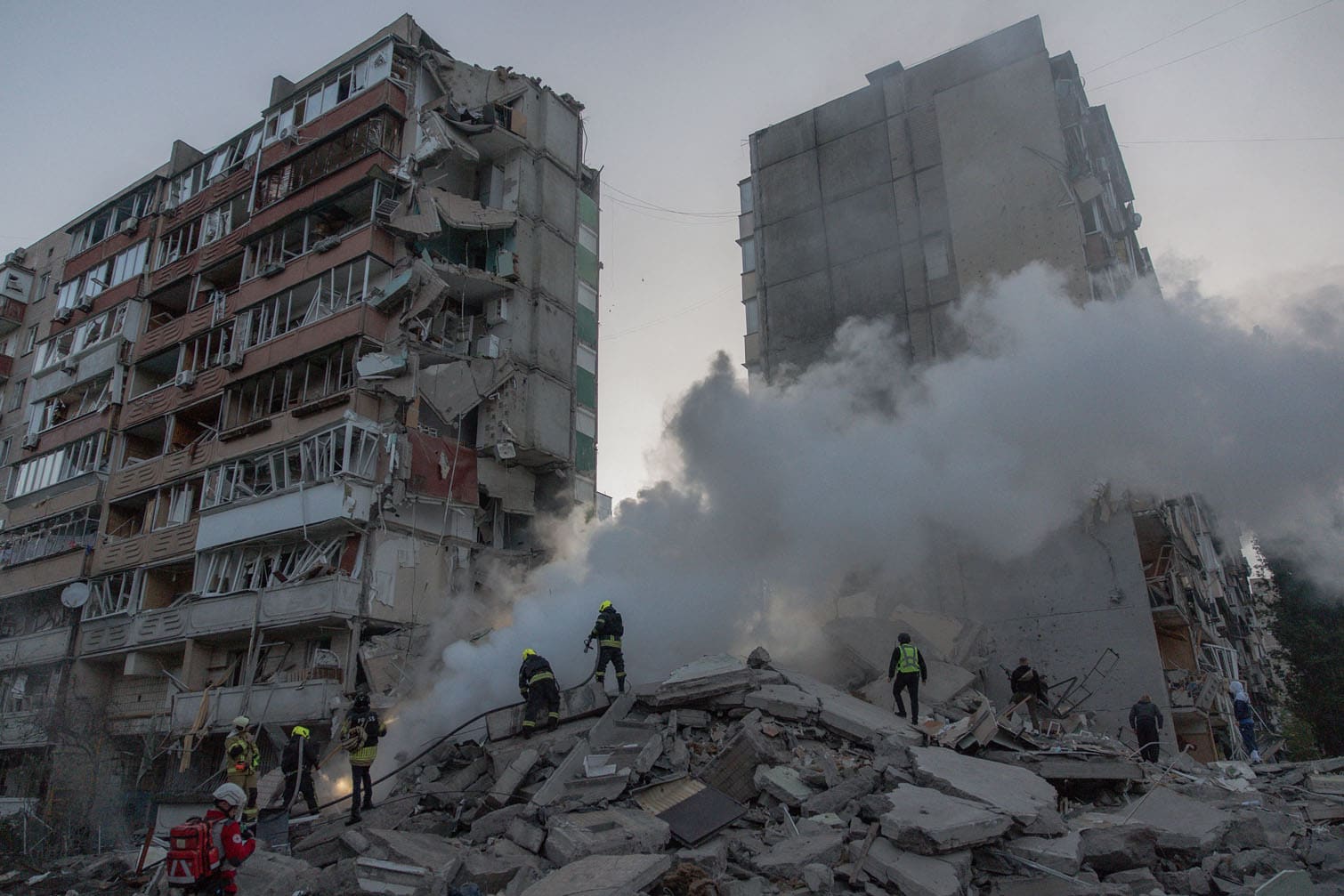 Rescuers work at a residential building
