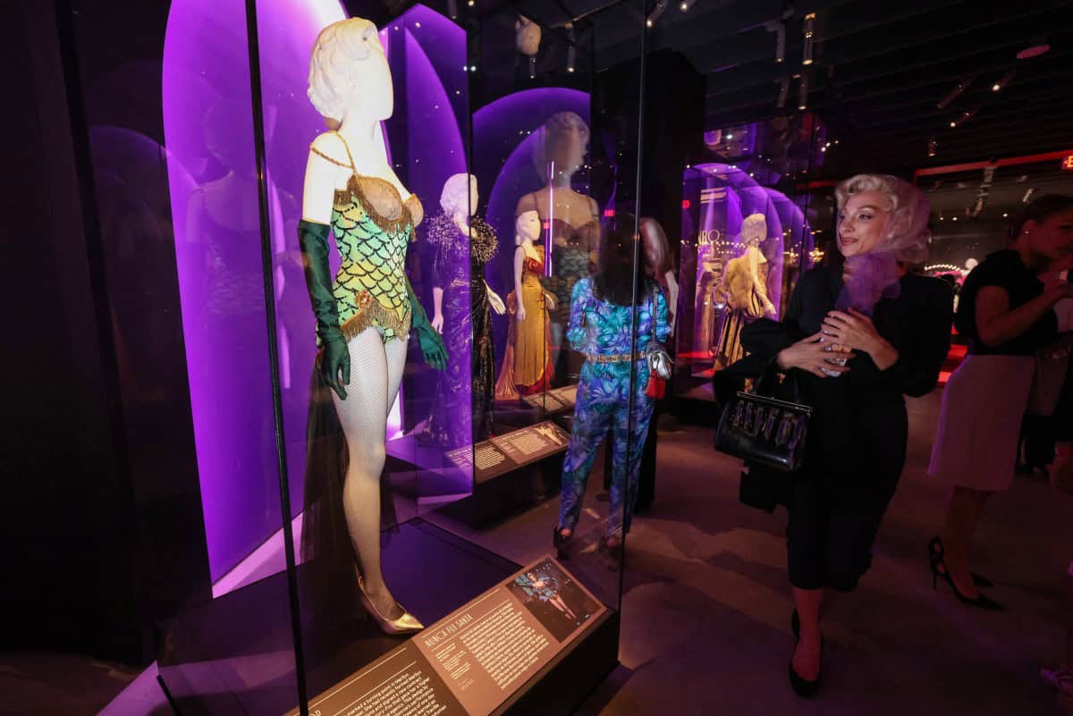 Guests view Marilyn Monroes dresses during the Exhibition Preview for