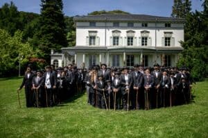 People dressed as "The Tramp" pose for a photograph next to The Manoir de Ban, the final residence of English film director and actor Charlie Chaplin, during an event to celebrate the 10th anniversary of the Chaplin's World museum in Corsier-sur-Vevey, western Switzerland, on 7 June 2026. Some 429 people took part in the event. Picture: Fabrice Coffrini / AFP