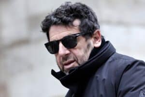 French actor and singer Patrick Bruel arrives to attend the funeral ceremony of French-Danish actor Niels Arestrup outside the Church of Saint-Roch in Paris, on December 10, 2024. Singer Patrick Bruel was taken into police custody on June 8, 2026 morning as part of an investigation into sexual assault "which at this stage concerns 13 presumed victims," the Nanterre public prosecutor's office said in a statement, confirming information reported by franceinfo. (Photo by STEPHANE DE SAKUTIN / AFP)