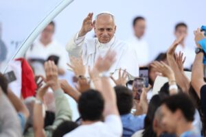 Pope Leo XIV greets the crowd as he arrives to attend a prayer vigil at the Lluis Companys Olympic Stadium in Barcelona, on June 9, 2026. Pope Leo XIV is visiting Spain June 6-12 with stops in Madrid, Barcelona, and the Canary Islands, where he will meet with migrants and organisations dedicated to helping them. Picture via Josep LAGO / AFP