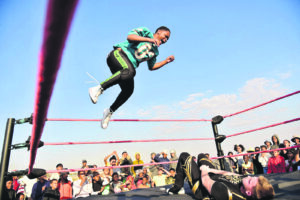 A wrestler jumping off the ropes in Eldorado Park