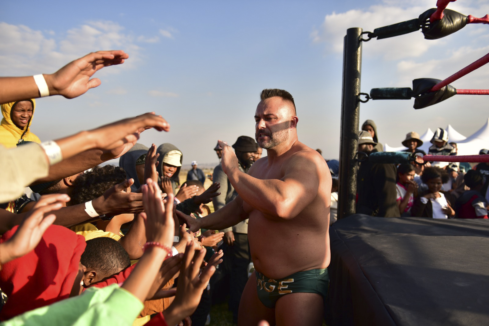 Ryan Cage greets the community after wrestling match in Eldorado Park