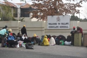 Crowd outside embassy wanting help