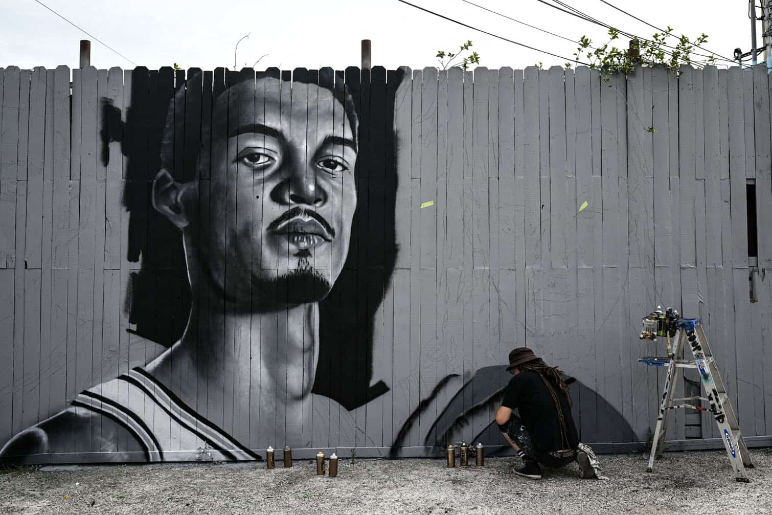 Artist Nik Soupe paints a mural