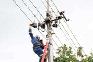 A technician repairing a electricity line.