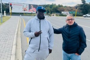 Maj Saffari and Rufas Mazwazi at the Cedar Road and Riverside Drive intersection opposite Steyn City School.