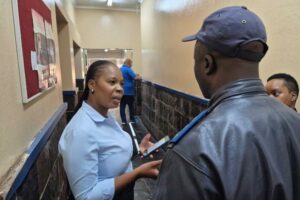 DA’s mayoral candidate Khathutshelo Rasilingwane speaking to one of the officers at Edenvale Police Station.