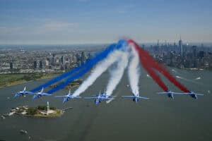 The Patrouille de France conducts a flyover