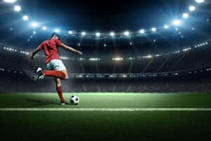 Football player in stadium stock image