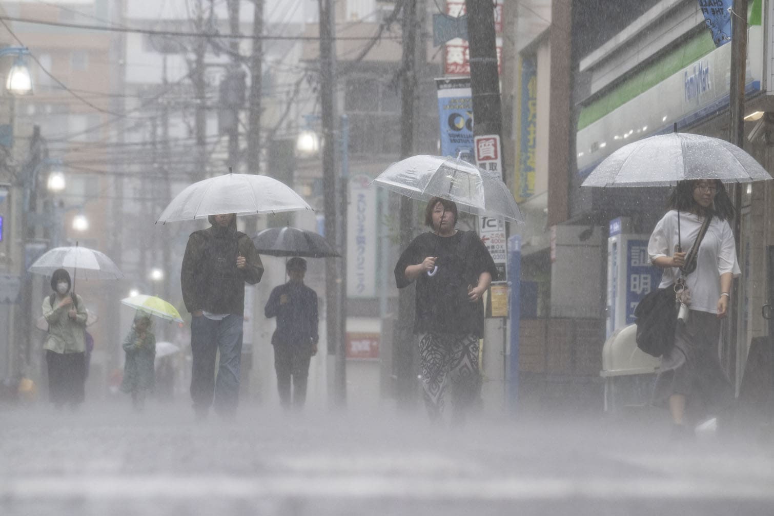 People commute in heavy rain