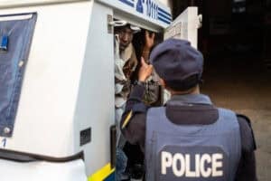 detained men inside a police van