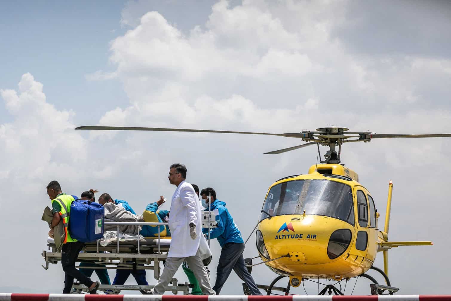 Medics and rescuers transfer mountaineer Dawa Sherpa