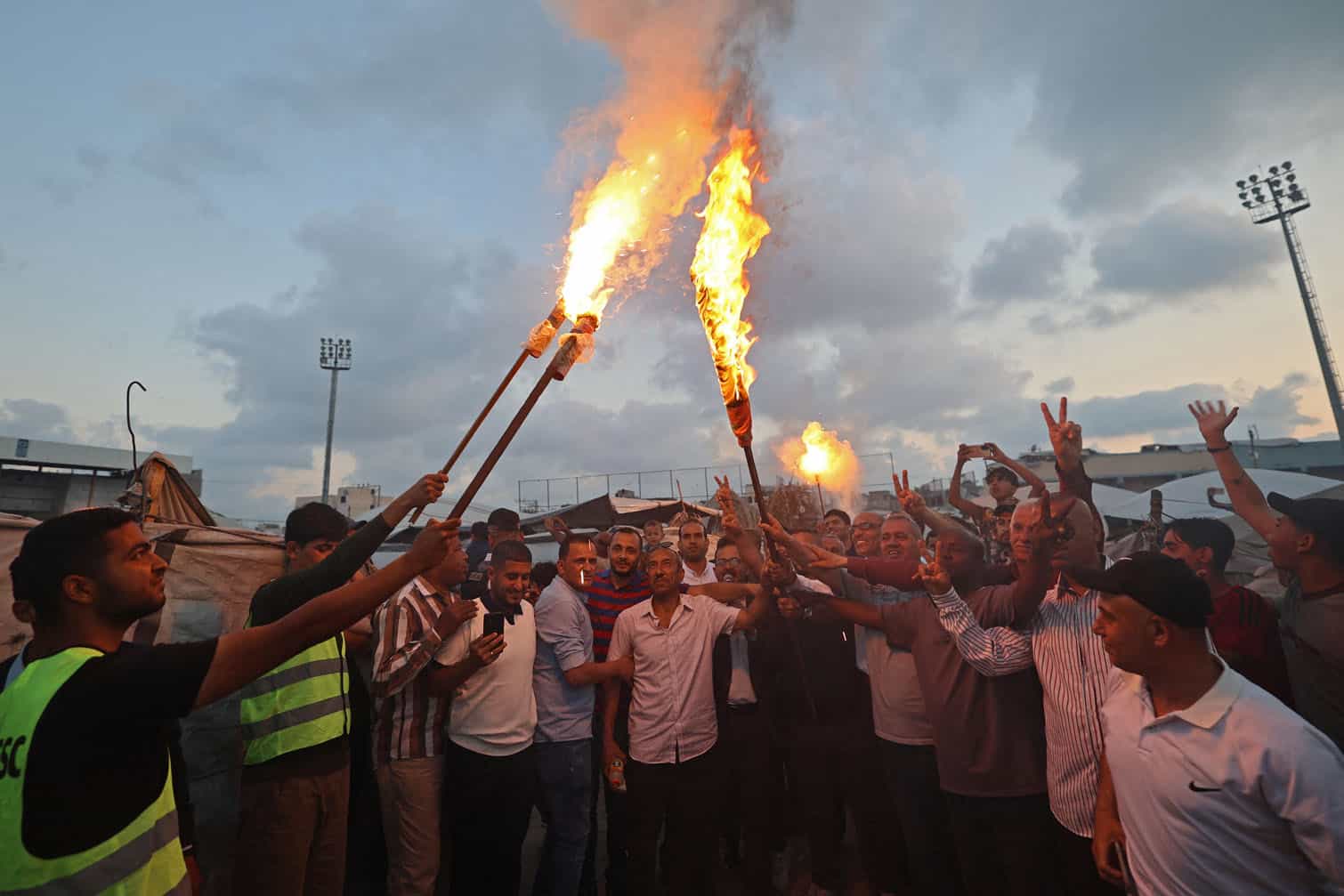 Palestinians light torches