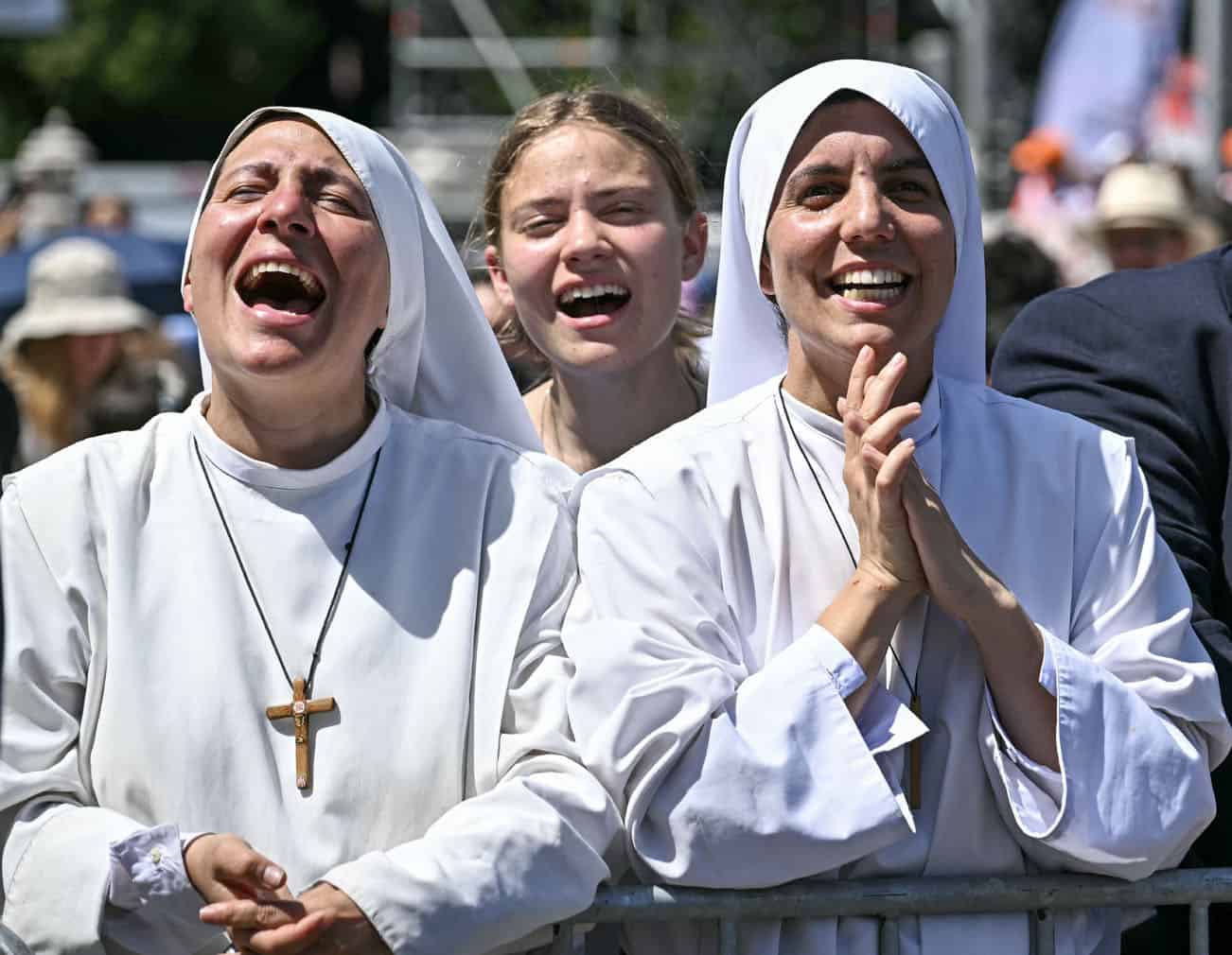 Nuns react following the Holy Mass