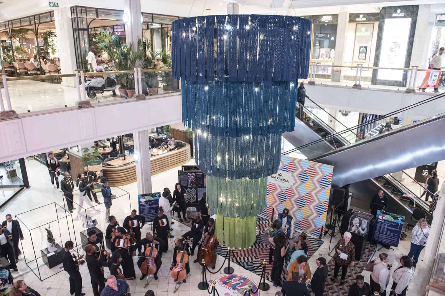 Guests attend the unveiling of the world's largest handmade scarf chandelier