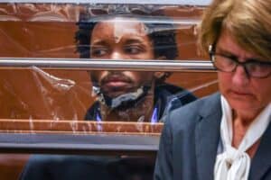 US singer D4vd is seen during his arraignment at Clara Shortridge Foltz Criminal Justice Center in Los Angeles, on April 20, 2026. Singer D4vd was charged Monday with the murder and dismemberment of a teenage girl whose decomposing body was found in an abandoned Tesla in the Hollywood Hills. The 21-year-old, whose real name is David Anthony Burke, appeared in court Monday to face multiple charges over the horrifying death of Celeste Rivas Hernandez, whose body was found in September, within days of what would have been her 15th birthday. Picture via Ted Soqui / POOL / AFP
