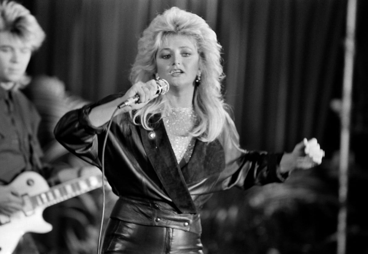 British musician Bonnie Tyler sings at the Maison de la Chimie in Paris on December 17, 1984. Welsh singer Bonnie Tyler best known for her powerful, haunting love song "Total Eclipse of the Heart" has died at the age of 75, her family announced on July 9, 2026. (Photo by PHILIPPE WOJAZER / AFP)