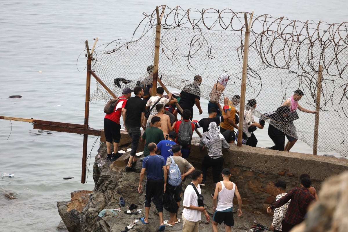 EU responds as thousands of migrants cross into Spain’s Ceuta from Morocco