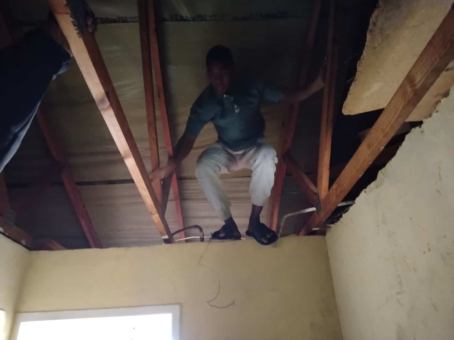 Foreigner hiding in the ceiling during inspection.