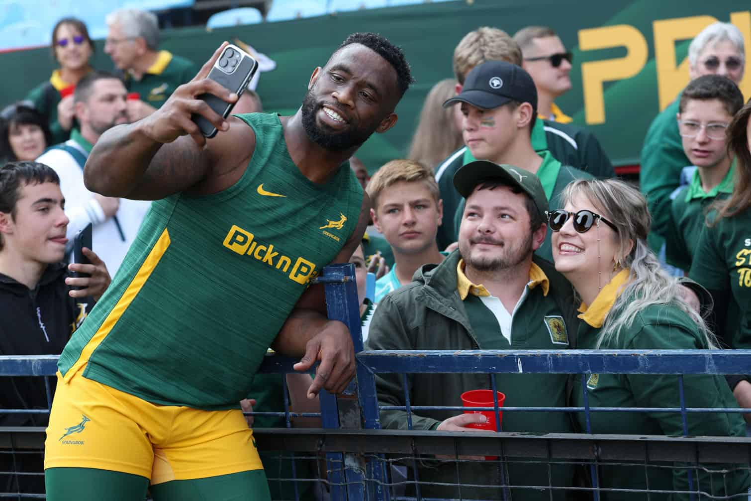 Siya Kolisi of South Africa poses for selfies with fans