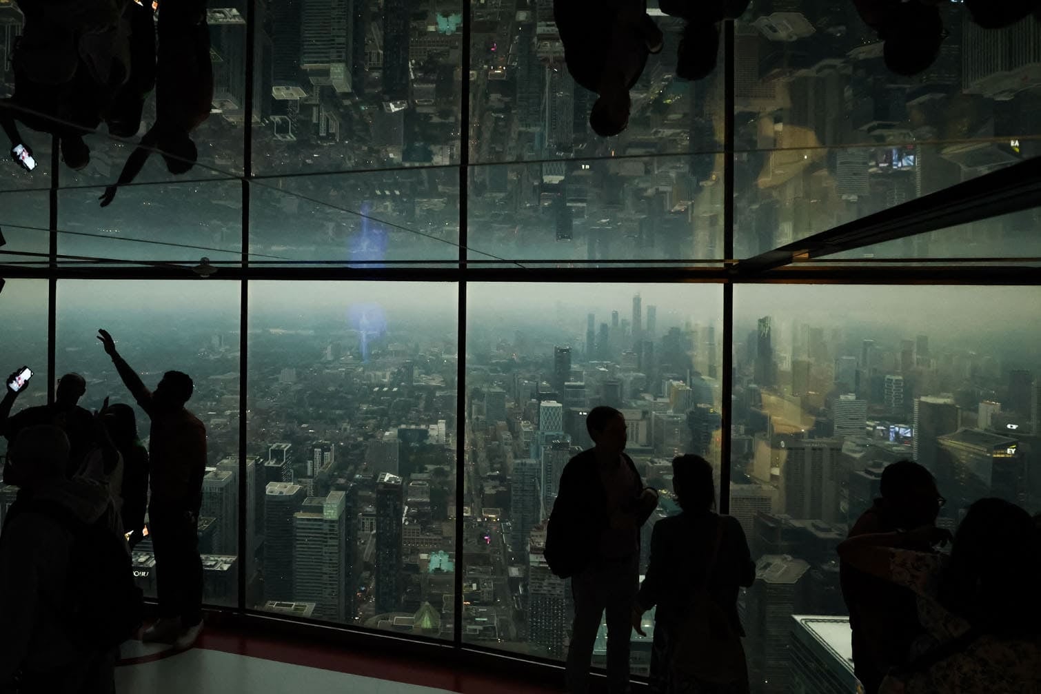 People look out from the CN Tower