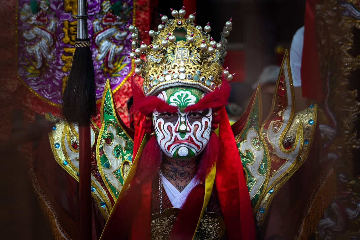 A performer, dressed as a guard of Na Tcha
