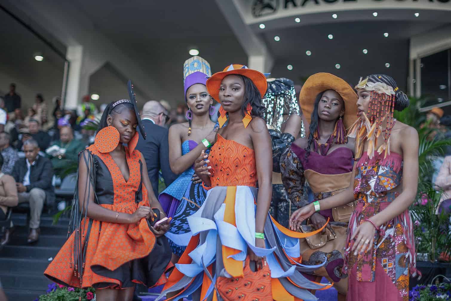 Models present creations by local designers during a fashion show