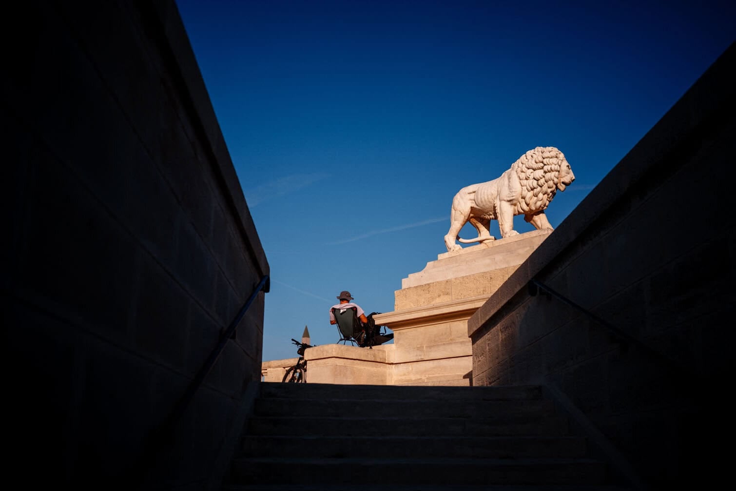 A tourist enjoys the sunrise