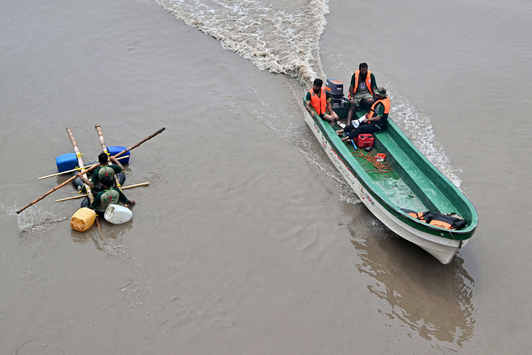 Relief personnel conduct a flood rescue drill